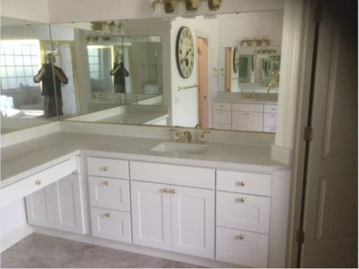 Bathroom cabinets installation and countertops finishing.